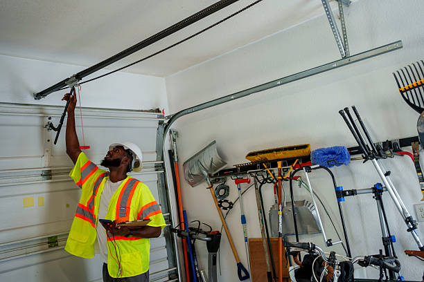 Professional Garage Door Roller Replacement technician working in Ellendale, ND